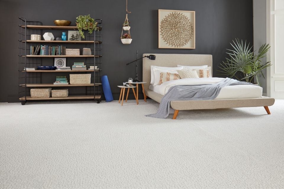 soft light gray carpet in a modern bedroom with gray walls