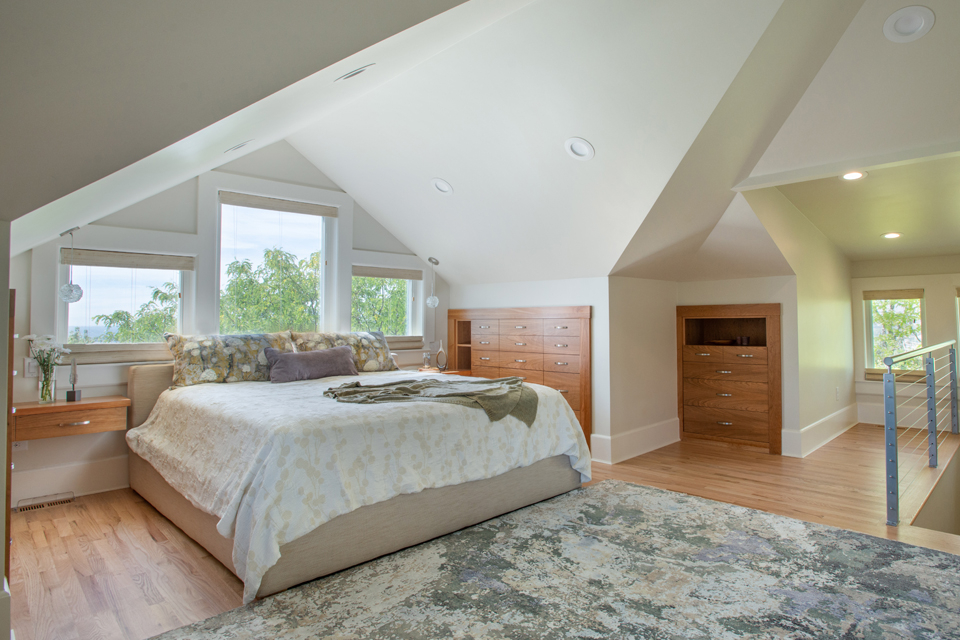 Large master suite with recessed lighting and built-in drawers