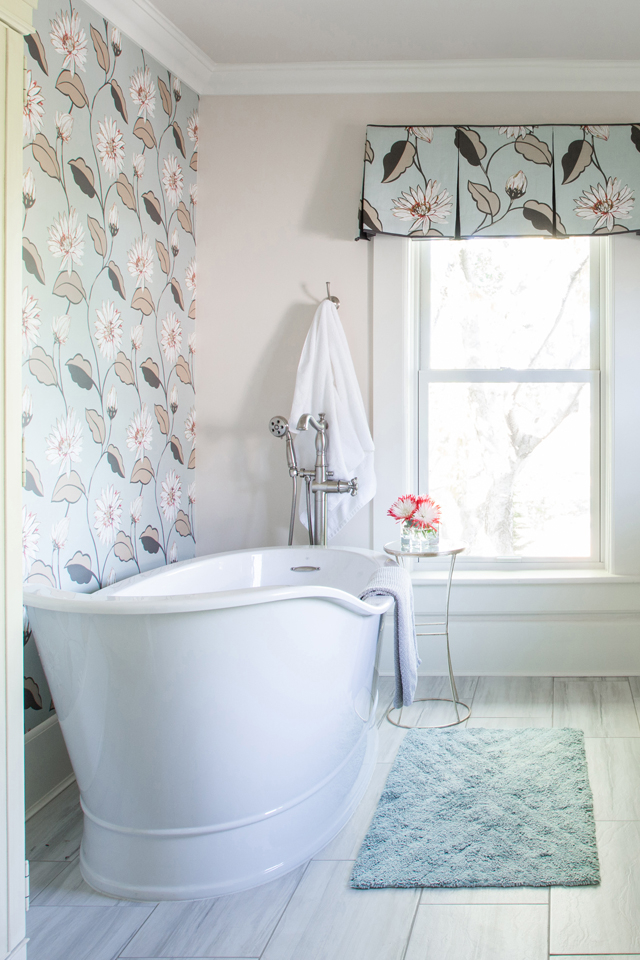 Fresh modern bathroom with floral wallpaper and soaking tub