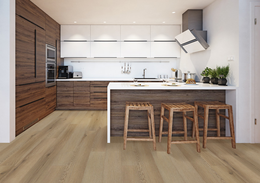 laminate flooring in kitchen with wood cabinets and island.