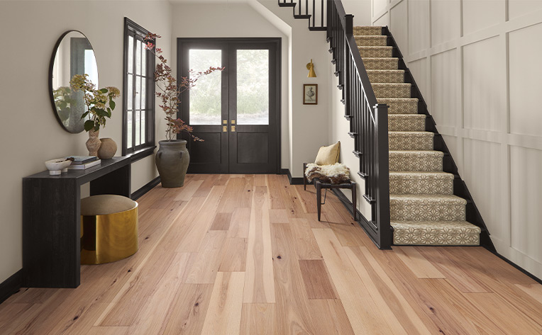 warm toned hardwood flooring in entryway