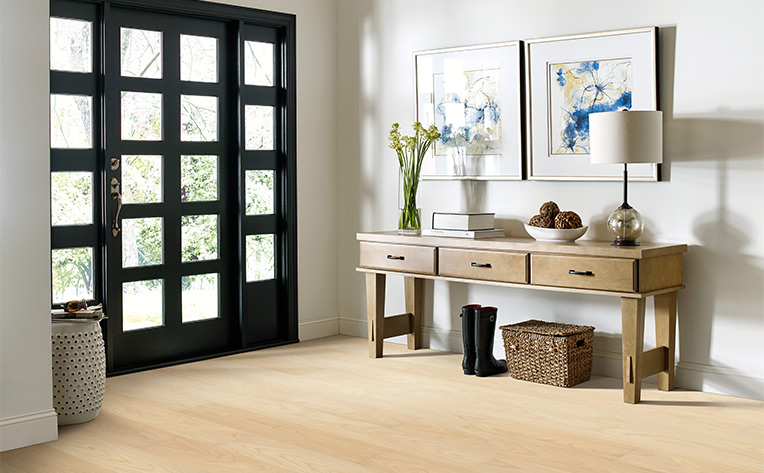 warm toned luxury vinyl plank flooring in entryway